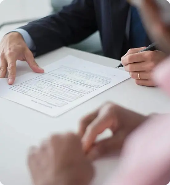 Business professionals signing documents for remuneration planning