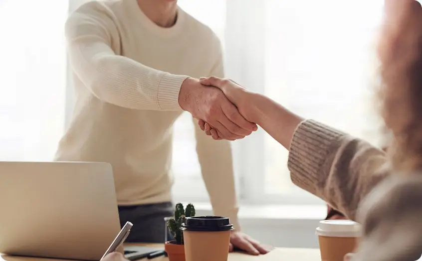 Handshake between colleagues for compensation leave support