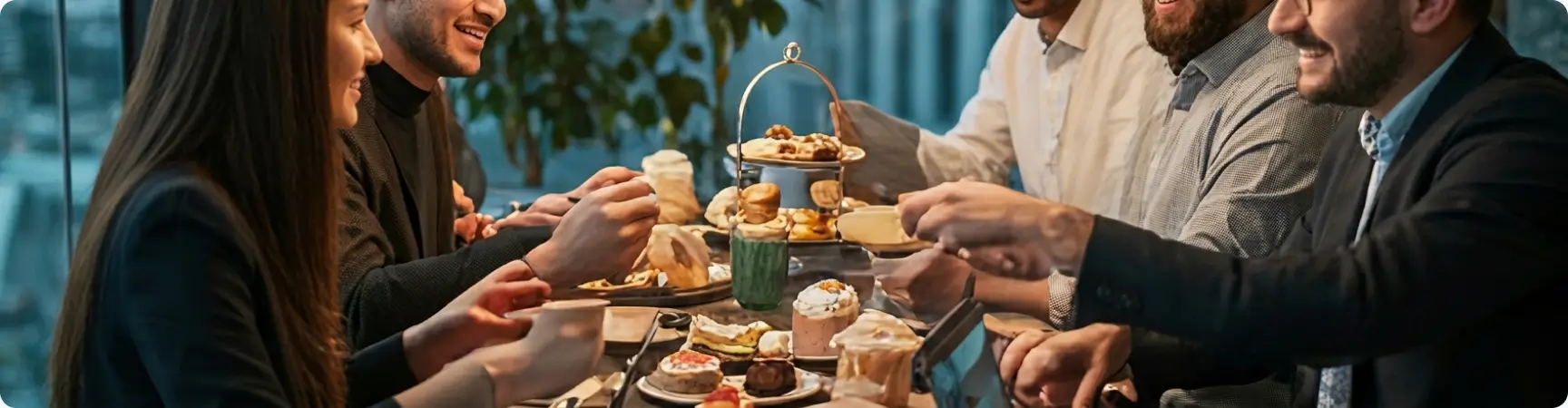 Team sharing afternoon tea for team building benefits